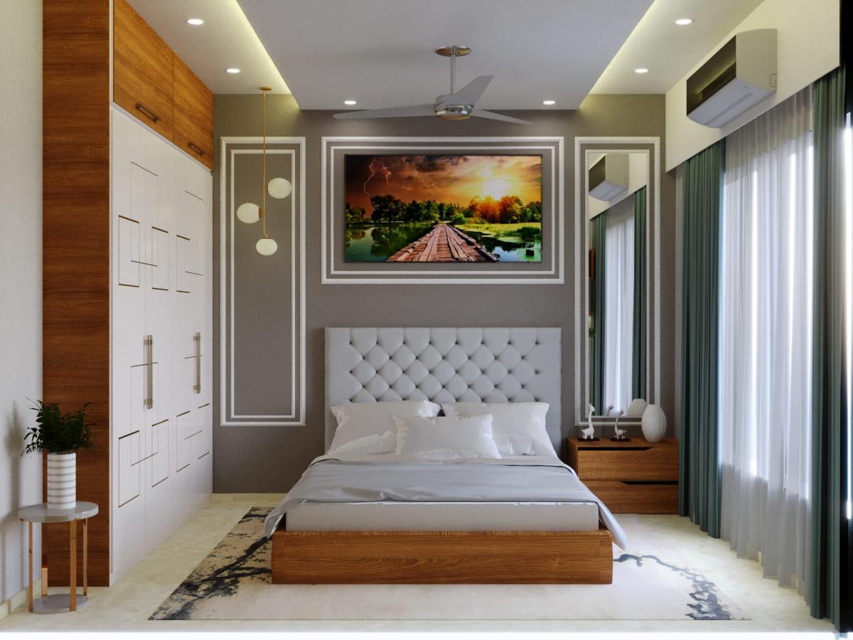 Bedroom with a tufted grey headboard, a landscape art panel and a white panelled wardrobe