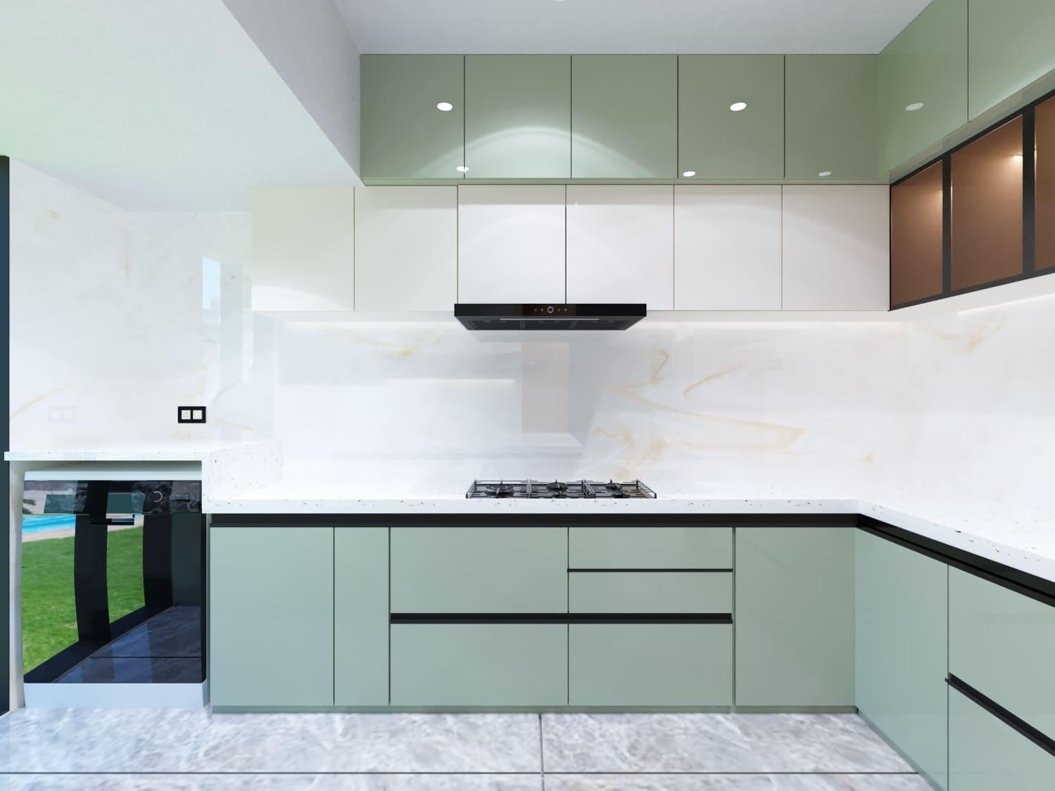 Sage-green kitchen with glossy white upper cabinets and a window over the counter