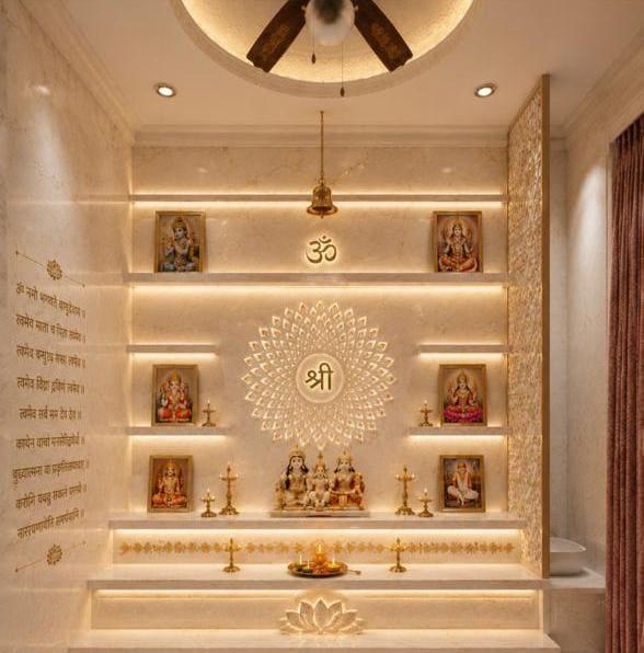 Backlit pooja unit in cream stone with a jali mandala and lit shelves