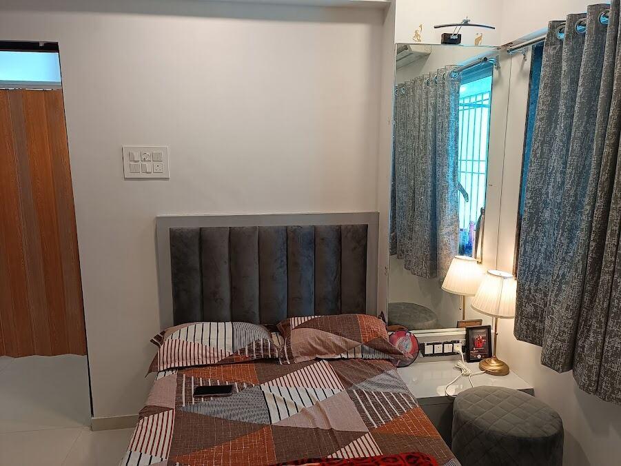 Master bedroom with upholstered headboard