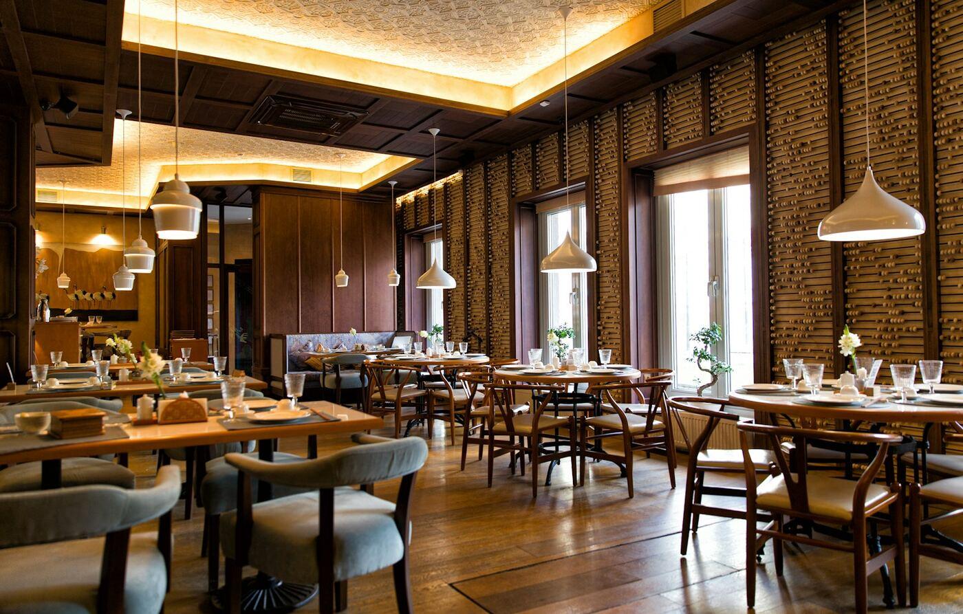 Restaurant dining room with warm pendant lighting