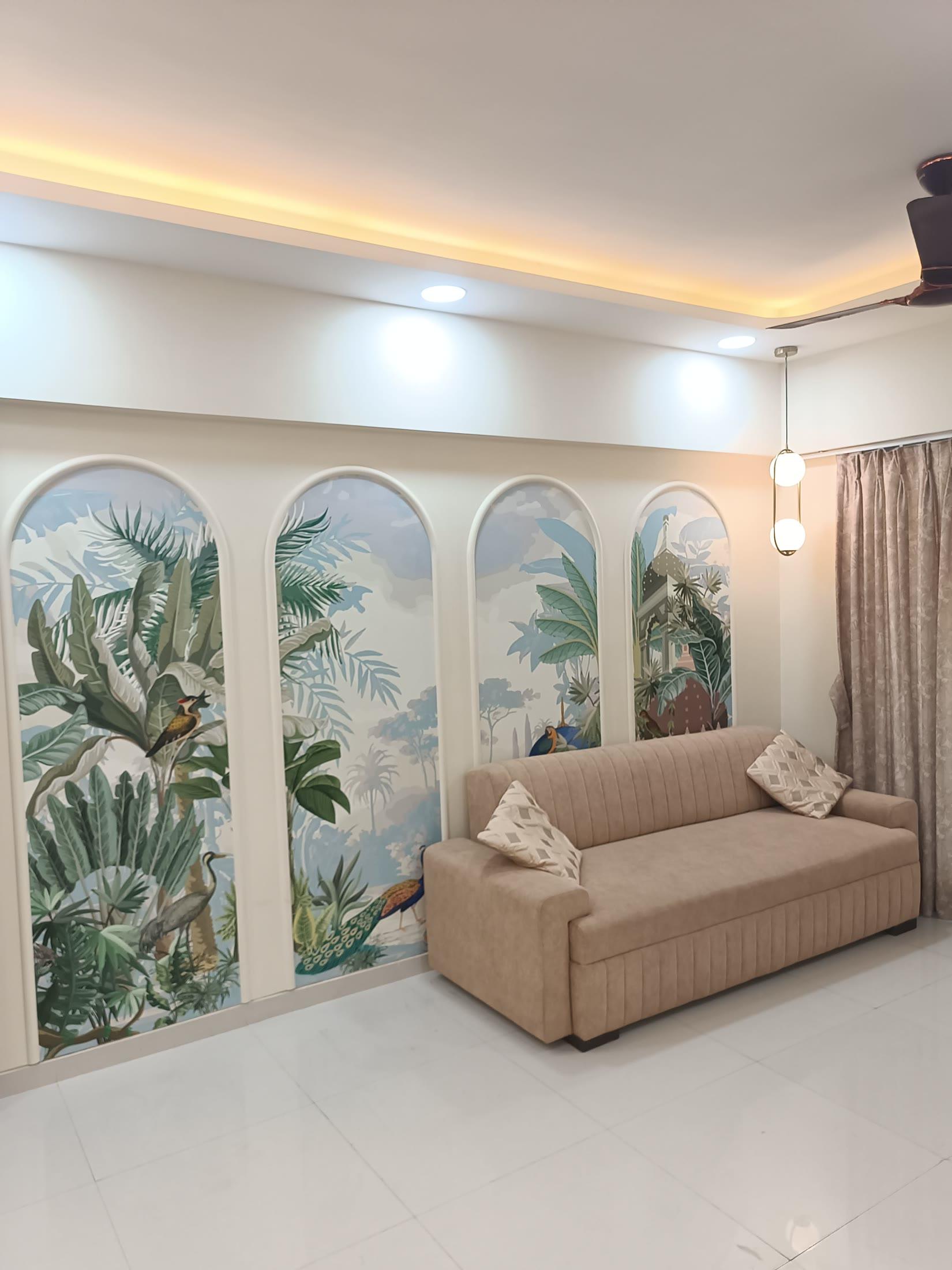 Living room with arched tropical mural panels, delivered turnkey by ARK Interiors