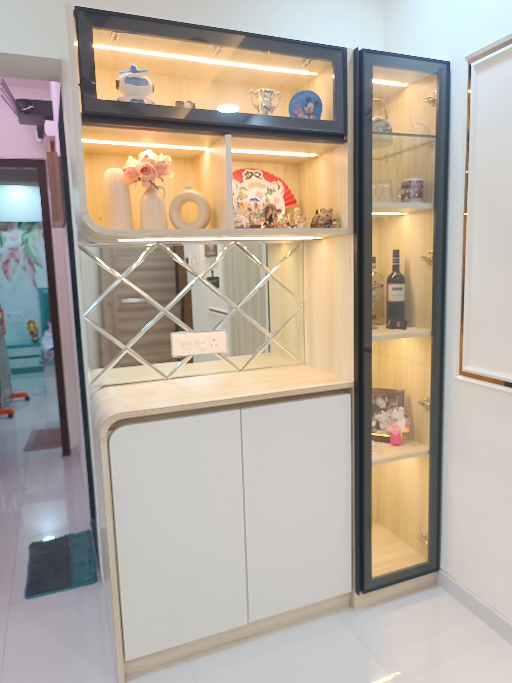 Bar and crockery unit seen from the side, showing the lit glass shutters
