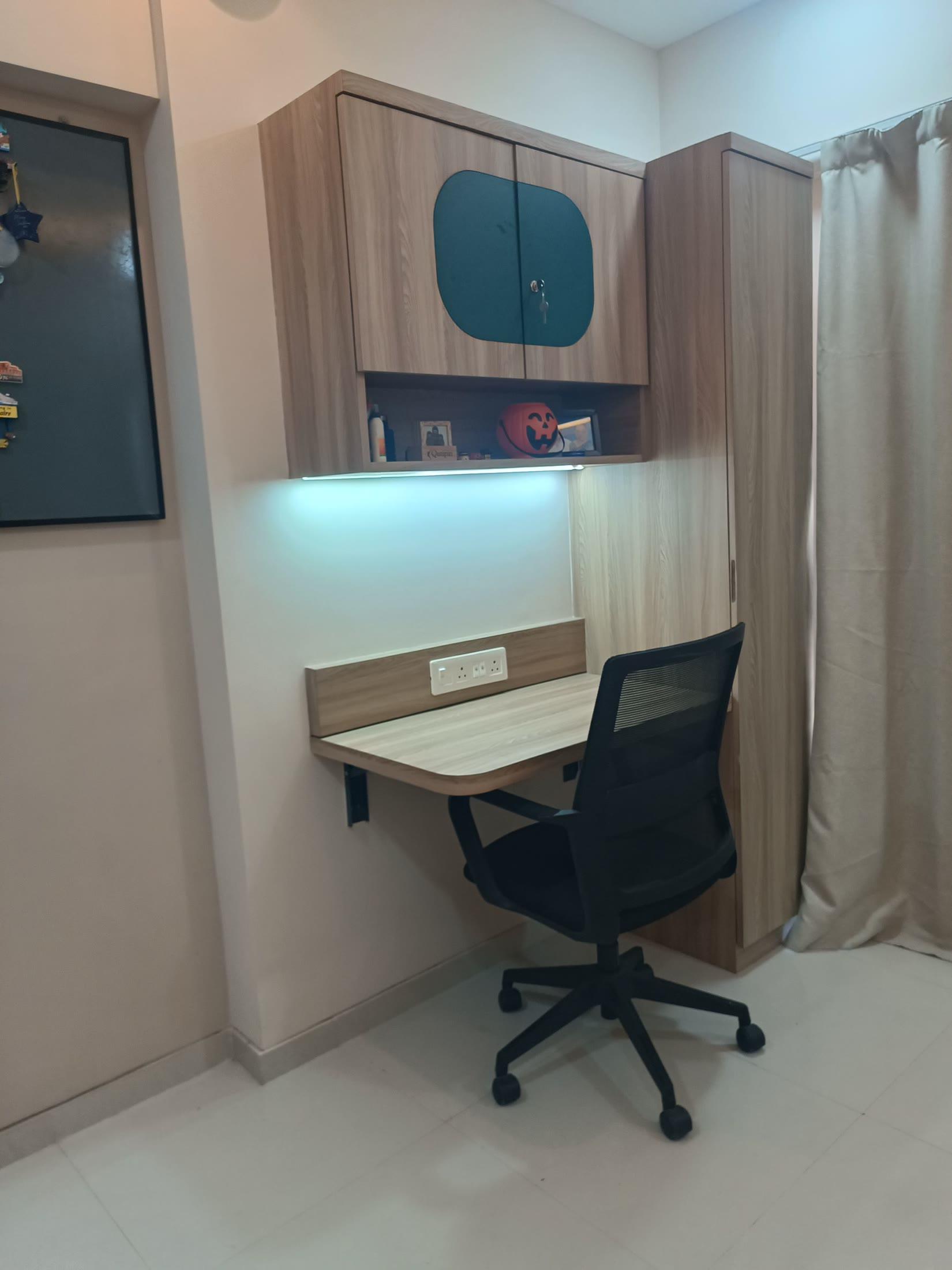 Foldable study desk with a teal overhead cabinet and a backlit shelf