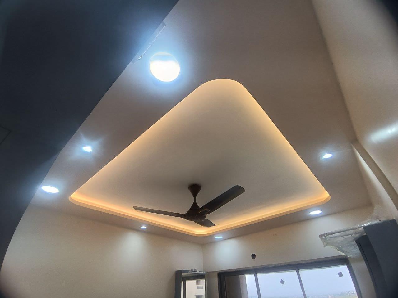 Cove-lit false ceiling detail above the living room