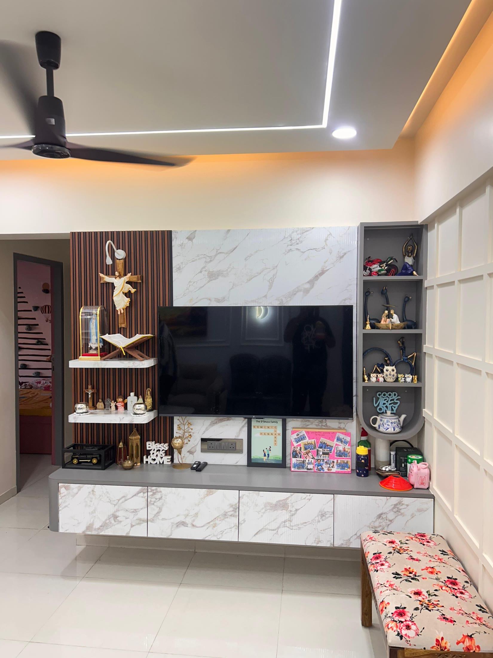 Television wall in marble and fluted wood with lit display niches
