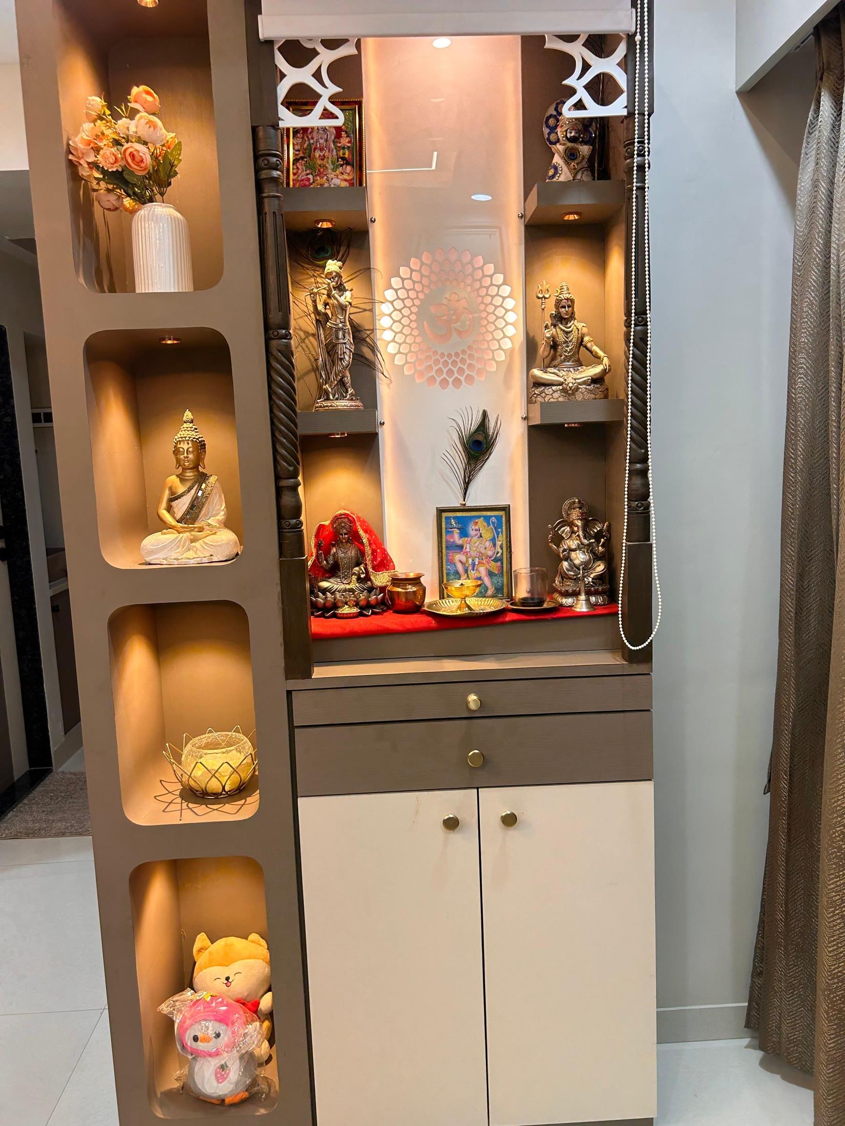 Pooja unit with a backlit jali panel and lit display alcoves