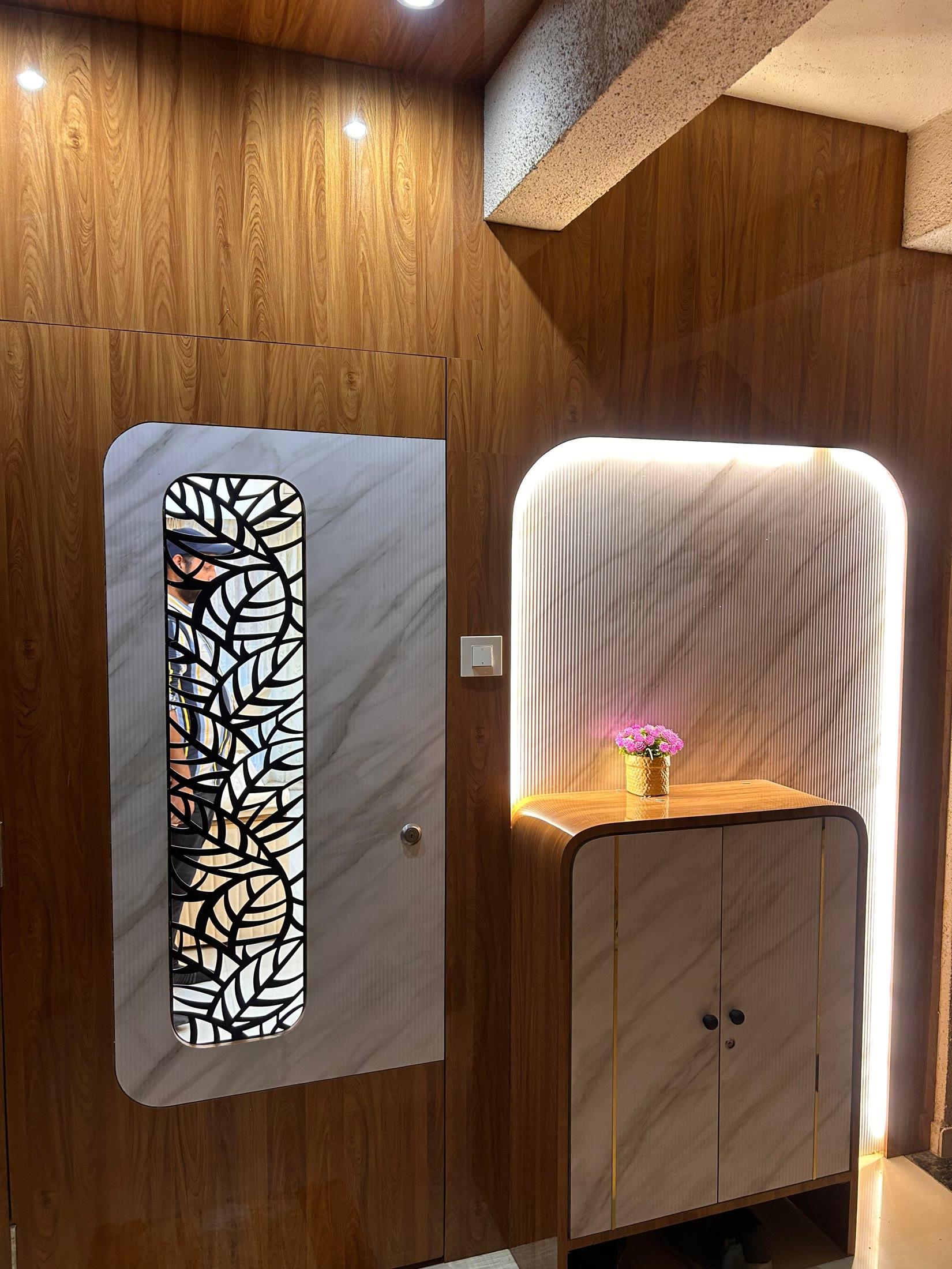 Foyer seen from the other side, showing the console drawers and lit mirror